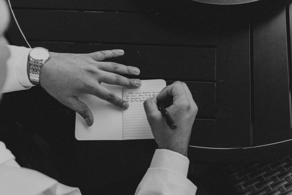 photo of groom writing vows