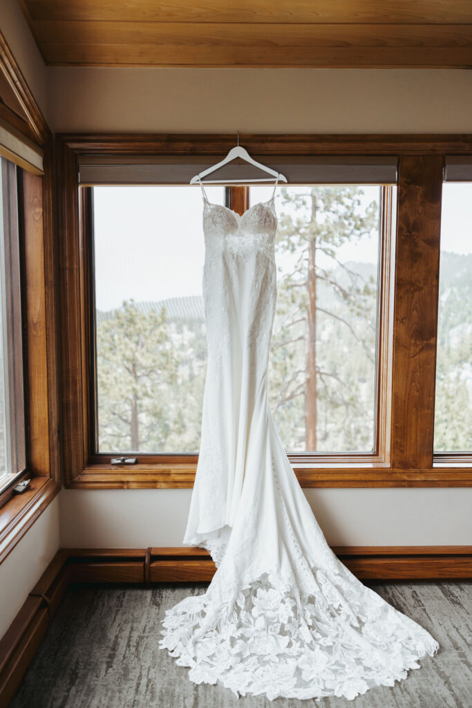 wedding dress detail photo hanging in window